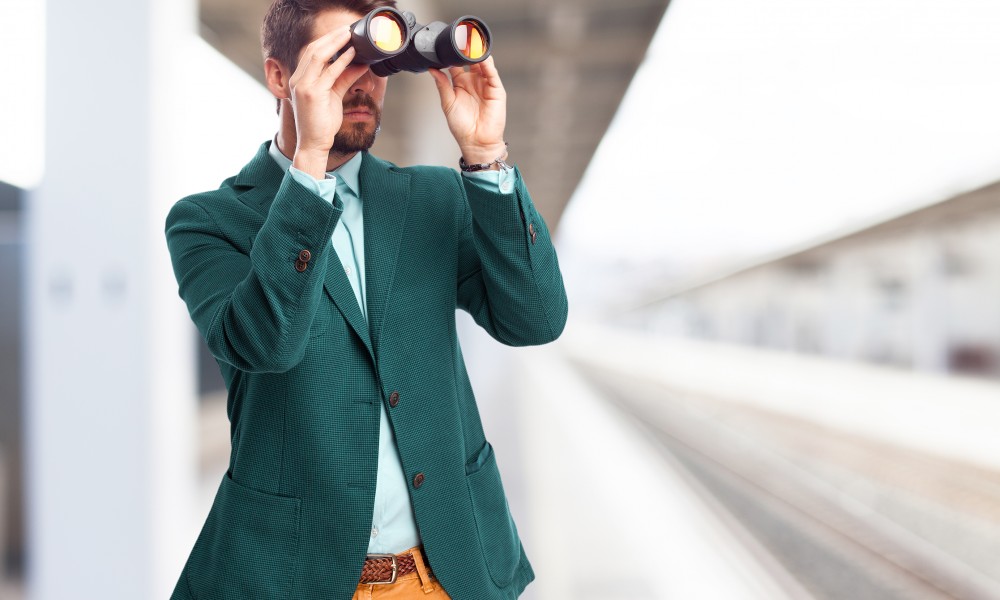 businessman looking for with binoculars