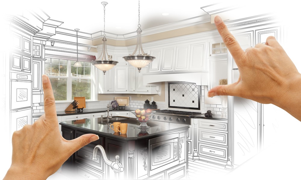 Female Hands Framing Custom Kitchen Design Drawing and Photo Combination.